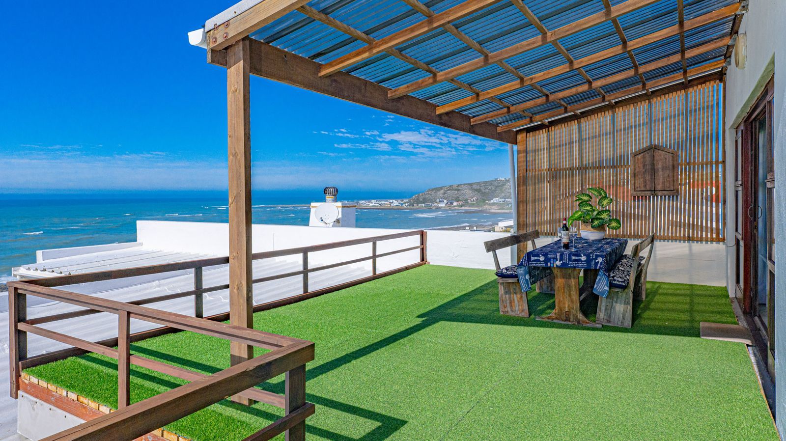 Outdoor dining table on Blue Whale's balcony