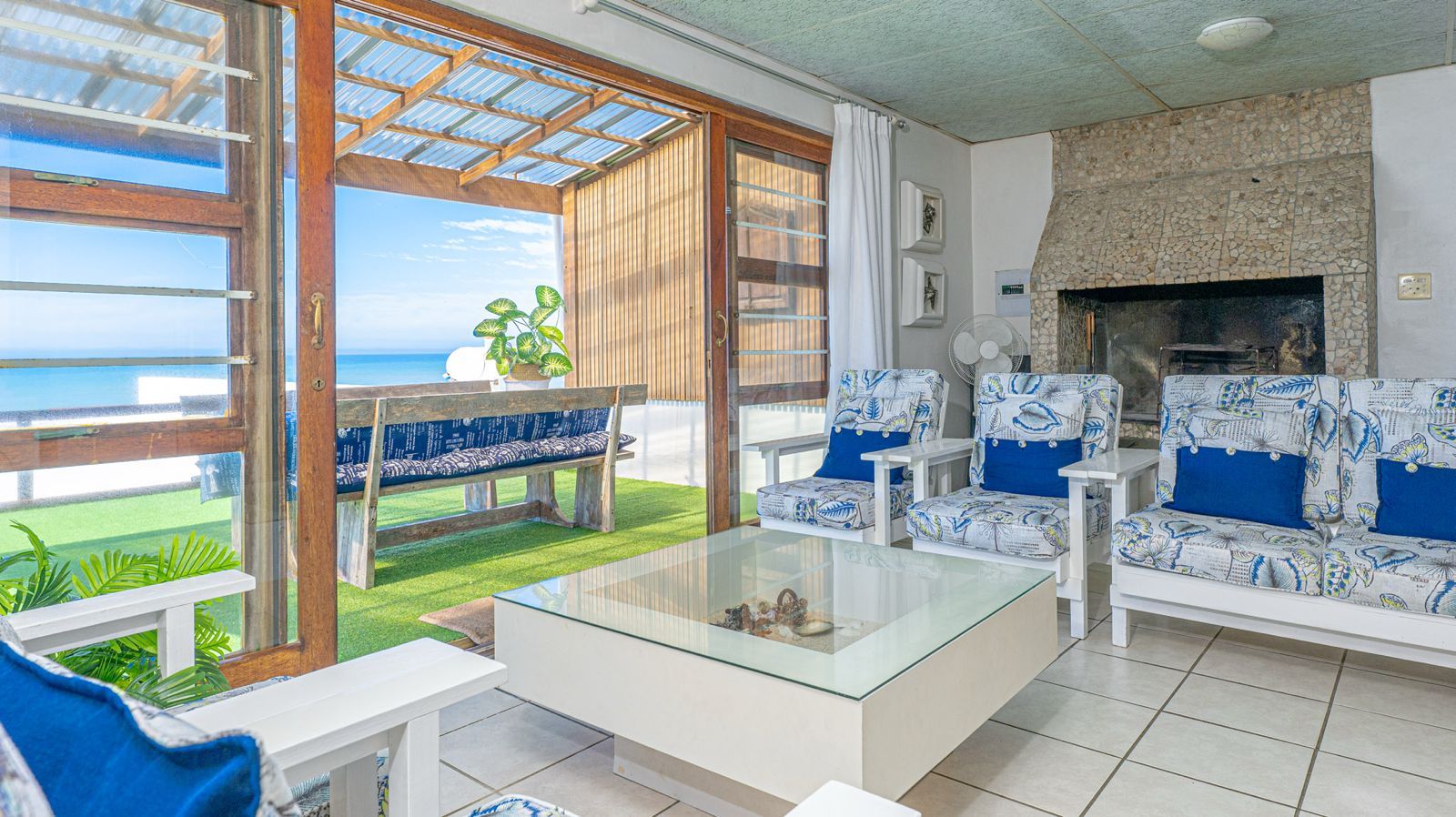 Blue Whale lounge with fireplace and balcony doors